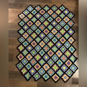 Crocheted throw blanket multi-colored